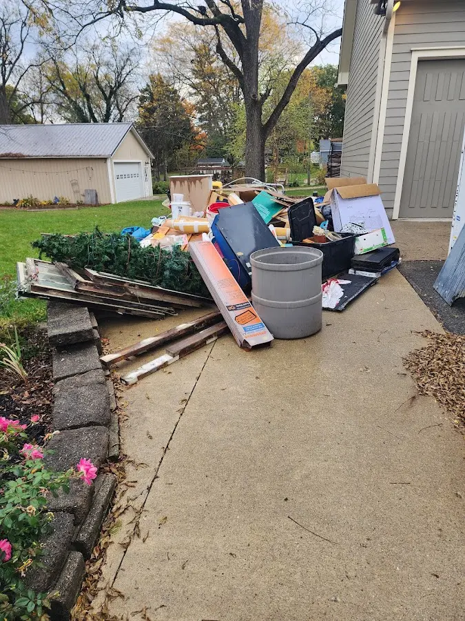 Dumpster being loaded with debris for 30 Yard Dumpster Rental in Hope